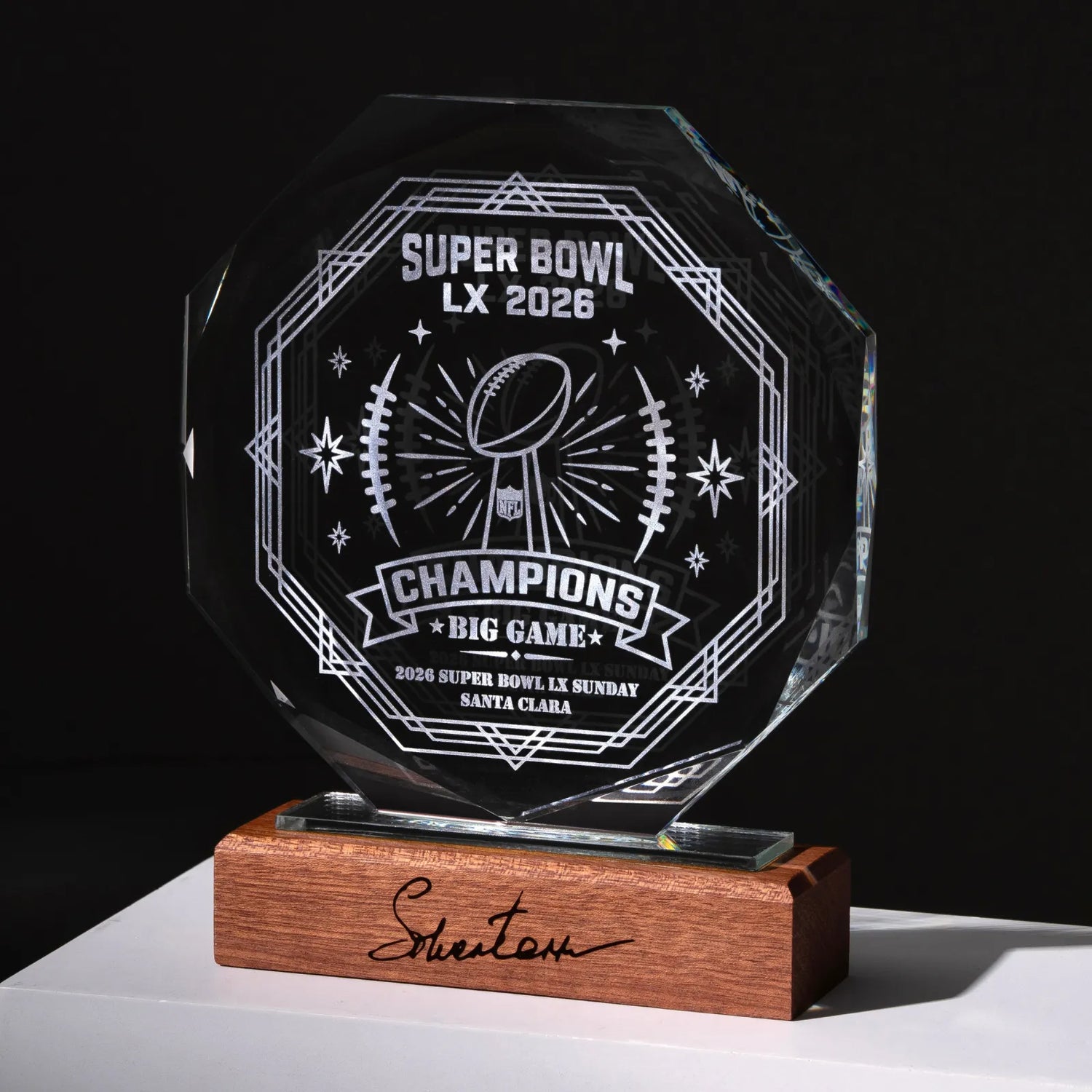 Custom octagonal crystal award engraved for Super Bowl champions on a wooden base